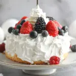 The BEST Smash Cake Recipe A light and fluffy smash cake for a baby's first birthday with no butter, no oil, and optional sugar. This is an angel food style cake, so be sure to follow the instructions on beating the egg whites and gently folding in the dry ingredients so that the cake will rise high and be light and fluffy. This cake is best baked in a 5×3-inch pan (see the notes for other options). Prep: 20minutes mins Cook: 20minutes mins Servings: 4 Save Recipe Pin Recipe Comment Print Recipe Cook Mode Prevent your screen from going dark Equipment 5×3-inch round pan Ingredients 1x 2x 3x For Cake: ▢4 Egg Whites, room temperature (from large eggs; reserve yolks for another purpose or discard) ▢1/3 cup Cake Flour ▢3 Tbsp Granulated Sugar (optional; see note) ▢1/4 tsp Cream of Tartar ▢1/4 tsp Pure Vanilla Extract (optional; adds flavor but is not neccesary) For Topping: ▢1/3 cup Heavy / Whipping Cream ▢2 tsp Granulated Sugar (optional; see note) ▢Fresh Berries (optional) Instructions Before getting started, set out the egg whites and let them come to room temperature (about 20 to 30 minutes). This will make them easier to beat into fluffy peaks. Make cake: Preheat oven to 325°F. Set out a 5×3-inch round pan. Do NOT grease the pan. Place the pan on a sheet pan (just in case any batter spills out as it bakes). If adding the optional sugar, whisk together cake flour and 3 Tbsp sugar in a small bowl. Set aside. Using a hand mixer or in the bowl of a stand mixer with the whisk attachment, combine egg whites, cream of tartar, and vanilla. Beat on medium-high speed until the egg whites form soft, fluffy peaks, 3 to 4 minutes. (Note: This is the most important step in making this cake. Beat the egg whites until the entire mixture is opaque, white, and fluffy throughout. The peaks should stand up straight with a little bit of a curl at the top when you lift the beaters out of the mixture.) Sprinkle the cake flour over the top of the egg whites. Use a whisk or spatula to gently fold the flour mixture in, being careful not to compress the fluffy egg whites. Pour the batter into the springform pan. (Note: Fill the pan right up to the top, rounding it gently with a spatula to create a smooth surface.) Bake until cake is set and the top is a light golden brown, 20 minutes. Remove cake from oven and invert over a cooling rack or two glasses / cans. Allow cake to cool completely upside down (for at least 1 hour). Run a knife around the edges of the cake to gently release it from the pan. Make whipped cream: Using a hand mixer or in the bowl of a stand mixer, combine cream with 2 tsp sugar (if using). Beat cream on medium-high until light, fluffy, and firm enough to spread over the top of a cake, 3 to 5 minutes. Just before serving (and when the cake is completely cool), spoon whipped cream over top of cake. (Note: If you want an even more photo-friendly topping, you can transfer the whipped cream to a small ziptop / plastic bag. Seal the bag and then cut off one corner. Genty squeeze the whipped cream out over the top of the cake in billowy rounds.) Top the cake with fresh berries, if you'd like. Serve! Notes Sugar – Sugar is completely optional. If you prefer a sugar-free option for your baby’s first birthday, just skip all of it. Without sugar, the cake tastes like a light and fluffy white bread. Sifting cake flour – If making the recipe as written, you should not need to sift the cake flour. Just lightly dust it over the entire surface of the egg whites before mixing it in. If doubling the recipe, it’s a good idea to sift the cake flour since you will be using more of it over a small surface area. This will help to insure that the flour can be easily incorporated (no lumps) without deflating the eggs. If not serving right away, wrap baked (and cooled) cake in plastic wrap and refrigerate for up to 3 days (let it come to room temperature before serving.) Cake can be frozen, tightly wrapped in plastic wrap, for up to 4 months. Defrost completely before serving. Baking Instructions for different pans: 5×3-inch Cheesecake Pan: This is my favorite pan for making this recipe. Follow instructions above as written. 6×3-inch Springform Pan: This is a wider pan than shown in photos. Use the slider next to “servings” above to make a double recipe. You may have some leftover batter, but this will insure you have enough batter to fill the pan. Bake this cake for 22 to 24 minutes. Allergy Note: This recipe contains dairy, eggs, and wheat. Please follow a medical professional’s guidance when introducing new foods to your baby, and always talk to your child’s pediatrician if you have questions or concerns about food allergies / sensitivities. Nutrition Serving: 1slice | Calories: 107kcal | Carbohydrates: 8g | Protein: 2g | Fat: 8g | Saturated Fat: 5g | Cholesterol: 27mg | Sodium: 8mg | Potassium: 56mg | Fiber: 1g | Sugar: 1g | Vitamin A: 290IU | Calcium: 13mg | Iron: 0.1mg Nutrition information is automatically calculated, so should only be used as an approximation. Author: Jess Smith via Inquiring Chef Calories: 107 Keyword: first birthday, healthy dessert, no-sugar cake, smash cake